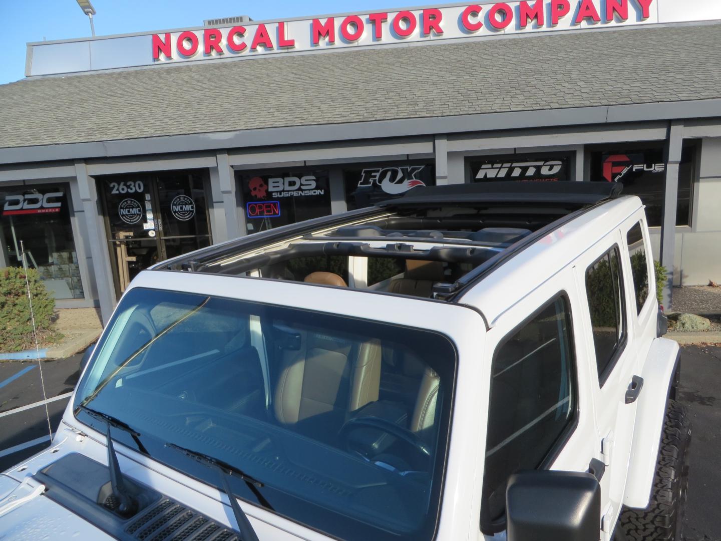 2020 White /TAN Jeep Wrangler Unlimited Rubicon (1C4HJXFG8LW) with an 3.6L V6 DOHC 24V FFV engine, 6A transmission, located at 2630 Grass Valley Highway, Auburn, CA, 95603, (530) 508-5100, 38.937893, -121.095482 - 3" Zone offroad suspension system, Fox adventure series shocks, rocksliders, Teraflex HD tire relocation, Mopar HD tailgate hinge, 17" KMC wheels, and 37" BFG KO2 tires. - Photo#62
